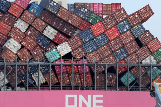Dislodged containers on the One Apus, berthed at Kobe after losing some 2,000 containers in...
