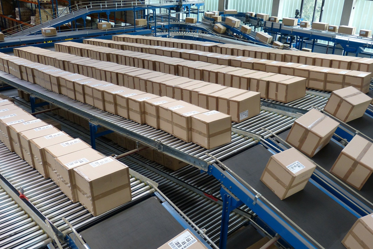 Packages on industrial conveyor belt.