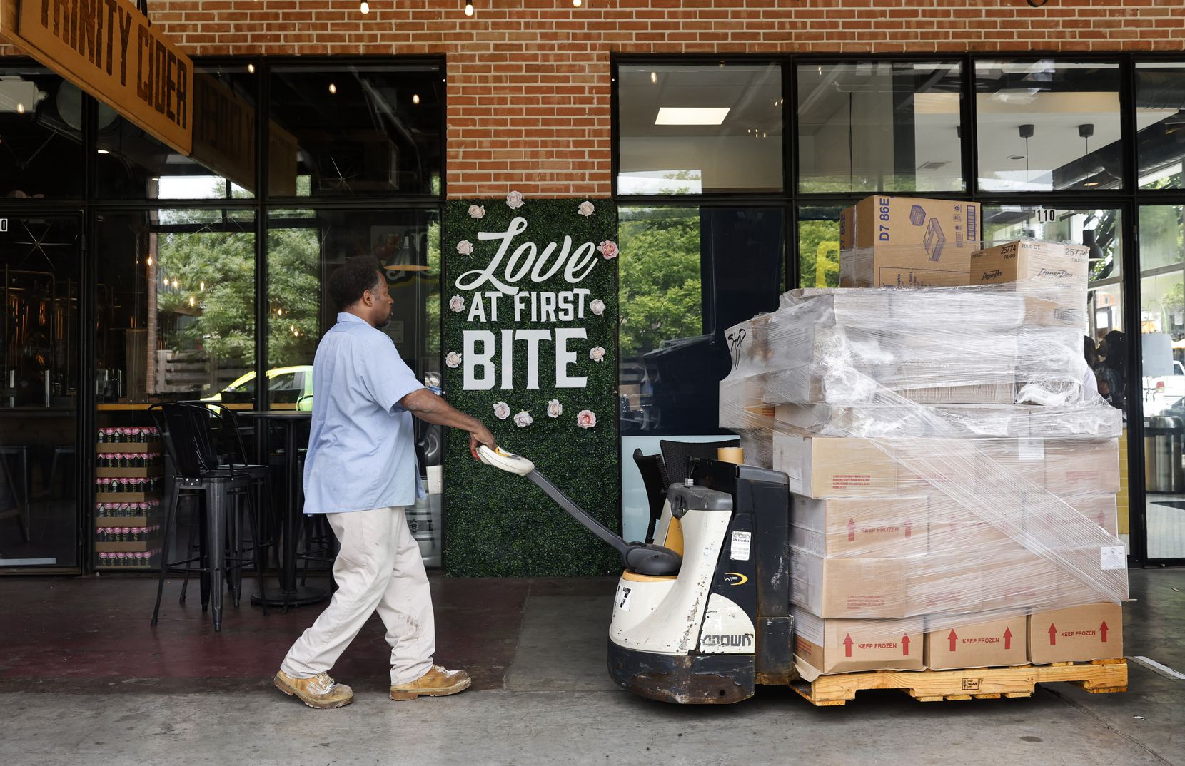 BakeMart driver Ravon Player makes a supply delivery to a Deep Ellum ice cream shop in Dallas, Friday, July 2, 2021.