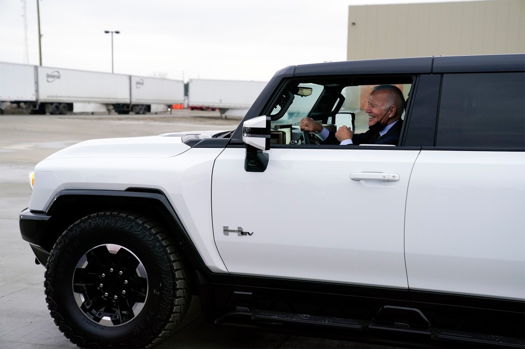 Biden test driving the electric vehicle at the assembly plant.