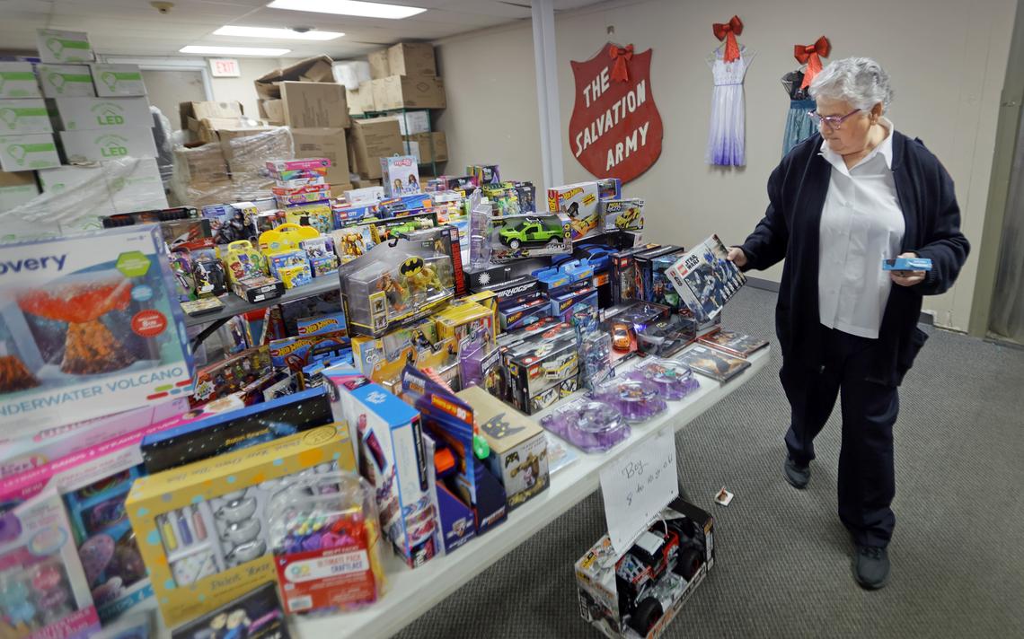 Maj. Ronda Tamayo places donated toys on age appropriate tables at the Salvation Army location in Moorhead on Wednesday, Nov. 24, 2021. David Samson / The Forum