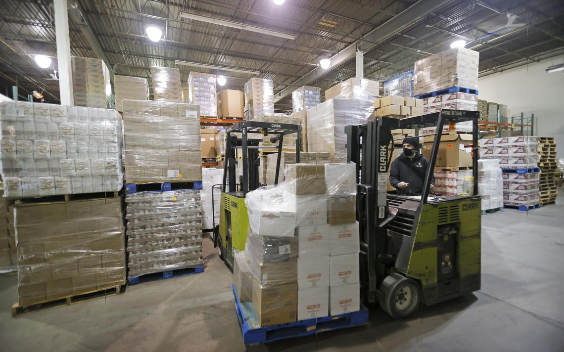 Isaac Romero loads a pallet with food items at the Great Plains Food Bank in Fargo on Friday, Nov. 19, 2021.
David Samson / The Forum
