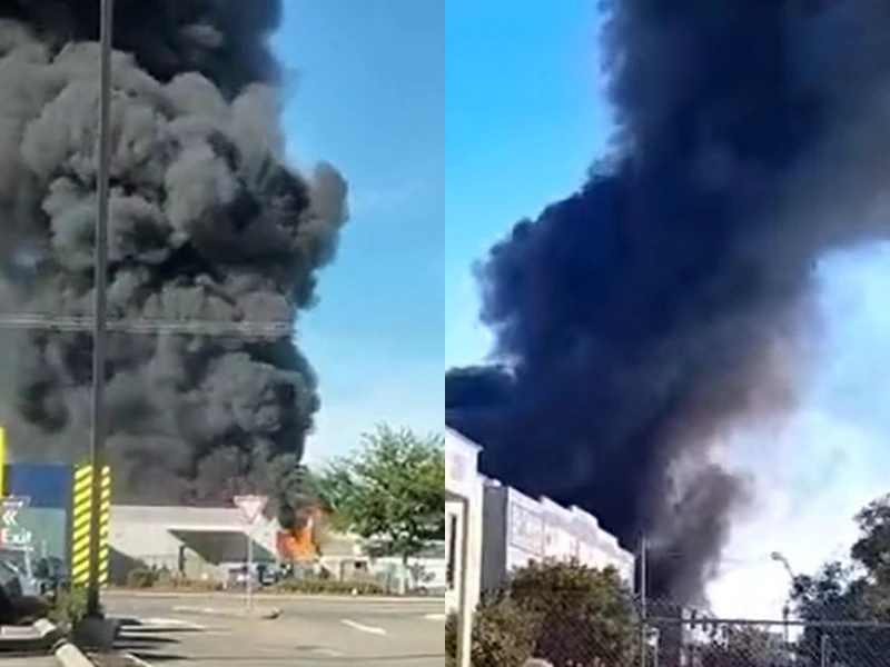 A composite image of black plumes of smoke filling the sky from the fire