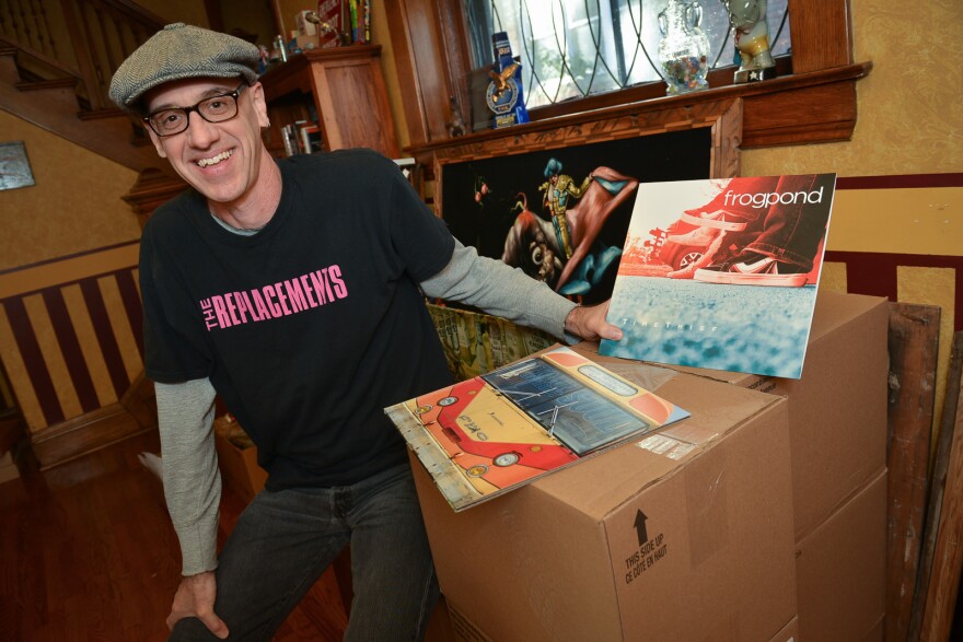 Man sitting on box, Shawn Saving