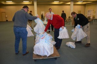 Kiwanis Club of Clarksville members load up bags of toys to be delivered to children in the Lafayette Head Start Program for Christmas, on Dec 7 2021. (Lee Erwin)
