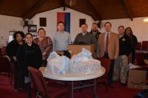 Kiwanis Club of Clarksville members and Head Start staff with toys to be delivered to children in the Lafayette Head Start Program for Christmas, on Dec 7 2021. (Lee Erwin)