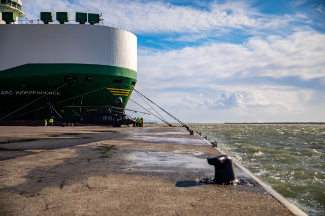 U.S. Army UH-60 Black Hawk helicopter belonging to 1st Air Cavalry Brigade (1ACB), 1st Cavalry Division is gently coated with the mist of the Aegean Sea as waves crash against the port of Alexandroupoli, Greece, Nov. 30, 2021. The port of Alexandroupoli is deep water, has a current pier capacity of 50,000 square meters that is further expandable and has rail and road linkages to facilitate transit operations for military movement. 