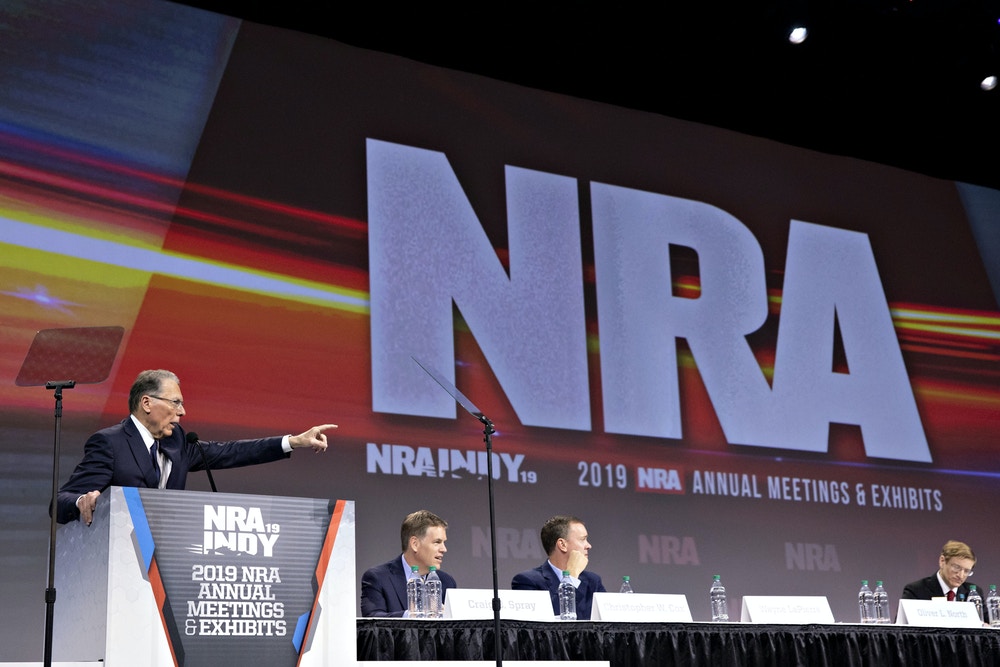 Wayne LaPierre, chief executive officer of the National Rifle Association (NRA), left, speaks during the NRA annual meeting of members in Indianapolis, Indiana, U.S., on Saturday, April 27, 2019. Retired U.S. Marine Corps Lieutenant Colonel Oliver North has announced that he will not serve a second term as the president of the National Rifle Association amid inner turmoil in the gun-rights group. Photographer: Daniel Acker/Bloomberg via Getty Images