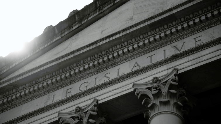 A picture of a state legislative building.