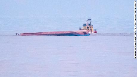 The capsized Danish cargo ship Karin Hoej (left) is seen on the Baltic Sea.