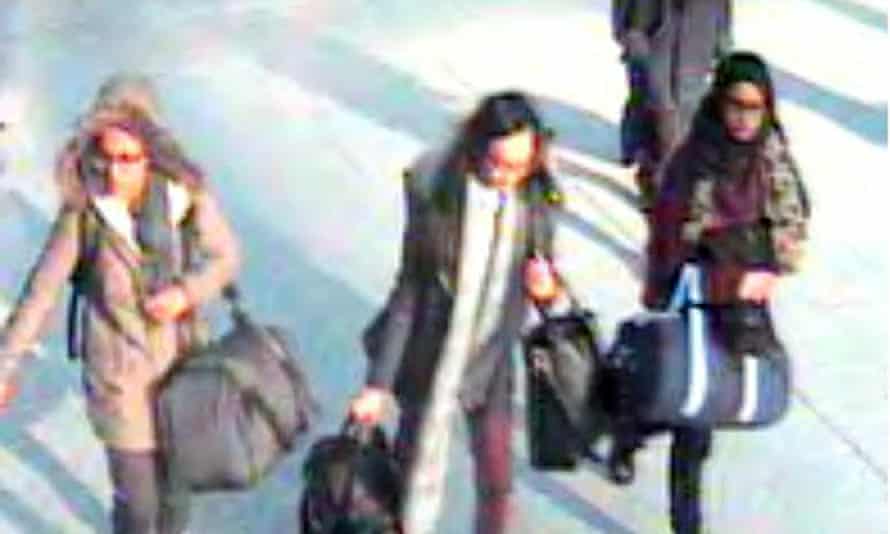 Three teenage girls carrying bags seen in an overhead CCTV still