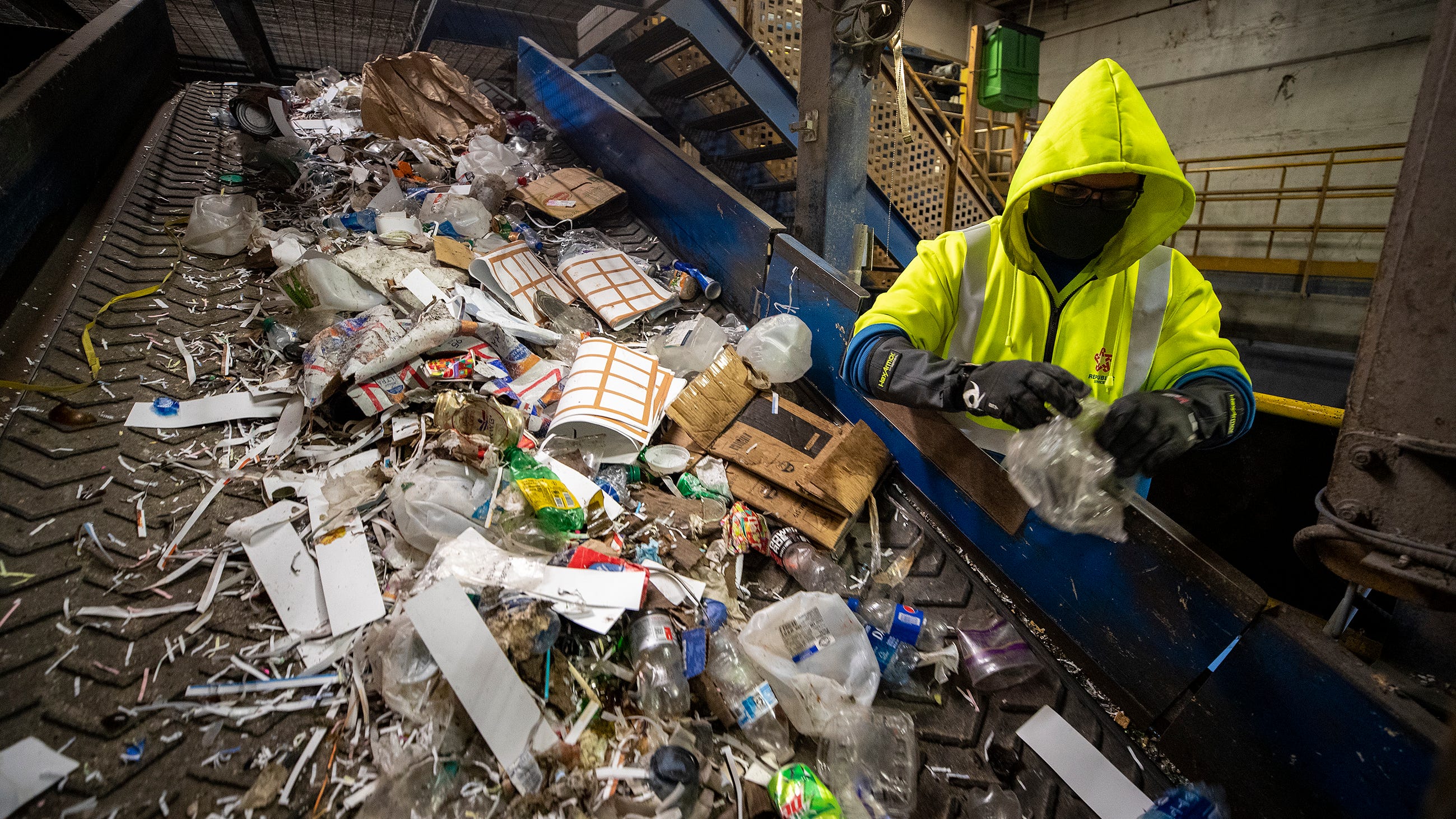 A Republic Services Recycling Center employee sorts recyclables in the Material Recovery Facility on Maine Street in Lakeland Fl. Monday November 15 2021.
ERNST PETERS/ THE LEDGER