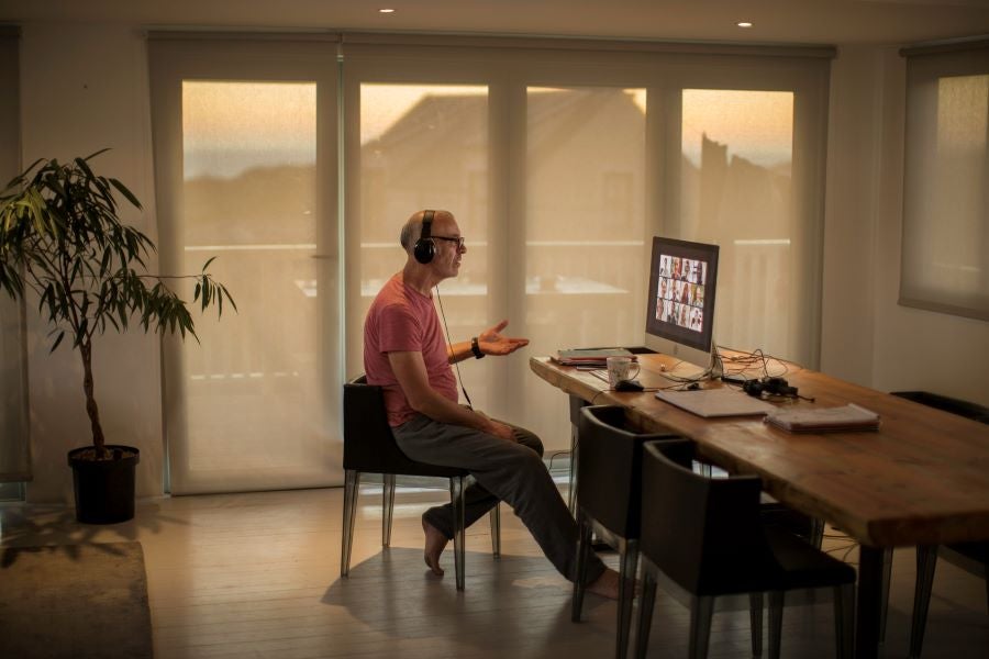 man-working-from-home-pyjamas-remote-working-zoom-call.jpg