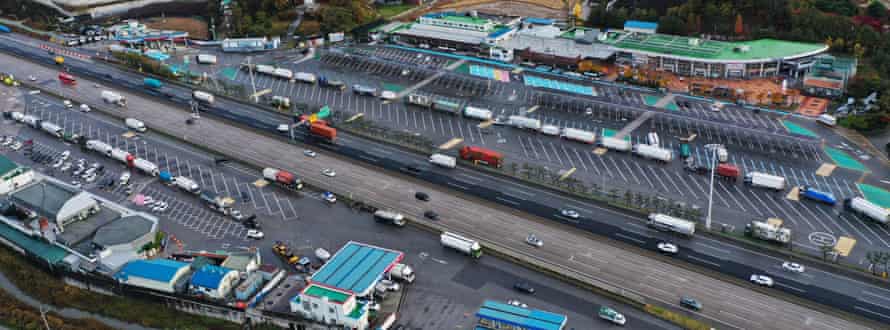 Trucks queue to buy urea at a petrol station on in Yeoju, South Korea