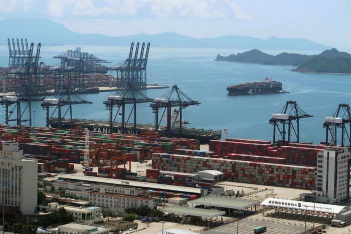 A cargo ship carrying containers is seen near the Yantian port in Shenzhen