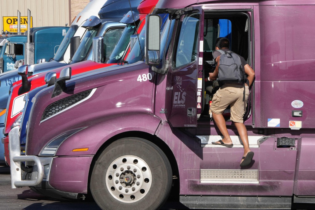 A trucker fuels up at a stop in Utah on Dec. 1, 2021.
