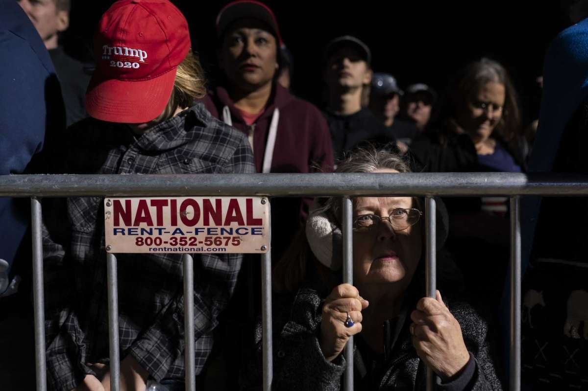 Supporters listen to former President Donald Trump speak at a rally on Saturday, Jan. 15, 2022, in Florence, Ariz.