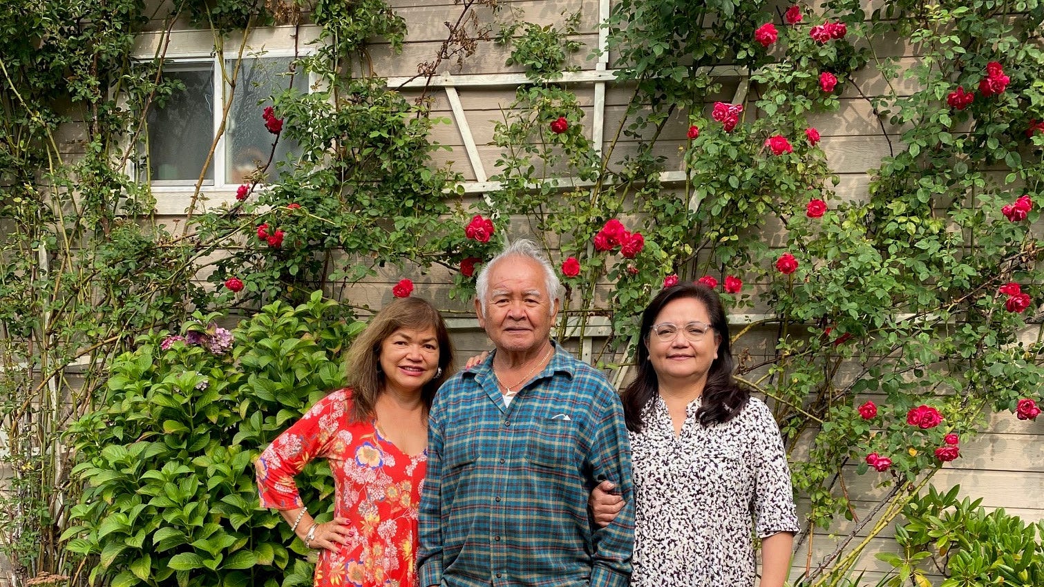 Disenrolled Nooksack Indian Tribe member Mike Rabang, center, and his daughters, Sevina Silva, left, and Michelle Roberts stand outside his Deming, Washington, home. The tribe is seeking to evict Rabang and Roberts from their homes.