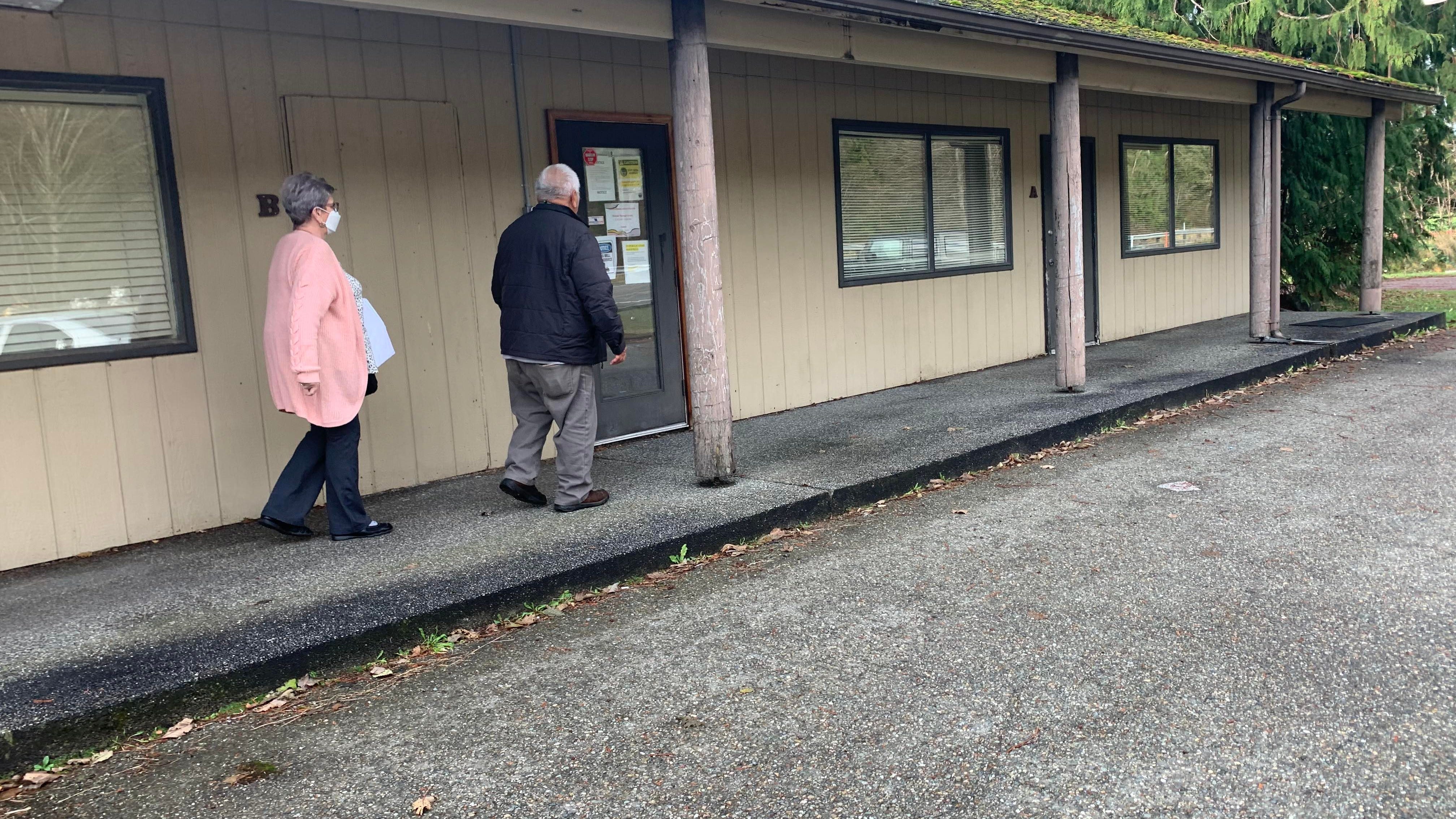Wilma, left, and Francisco Rabang, two disenrolled Nooksack Indian Tribe members, head into a meeting at the tribal housing aurhority regarding an eviction proceeding against them.