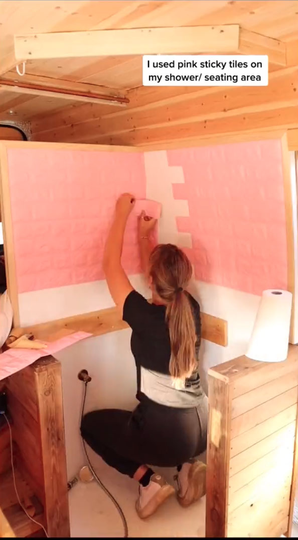 She added stick-on pink tiles for £14 to make the interior look chic