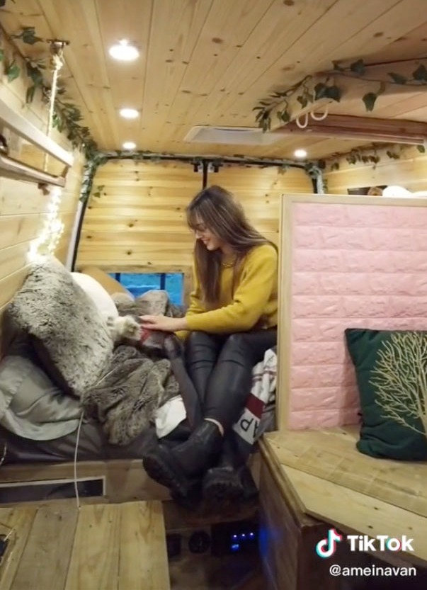 She added a double bed to the back of the van for when she is on the road