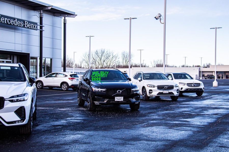 Cars+for+sale+in+a+car+dealership+parking+lot.+The+price+of+new+and+used+cars+has+increased.+