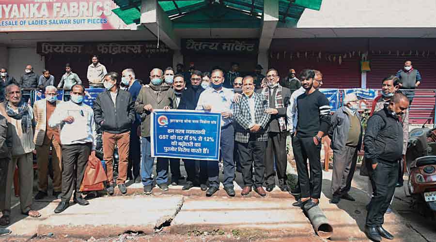 Textile wholesalers protest after closing their shops in Ranchi on Friday.