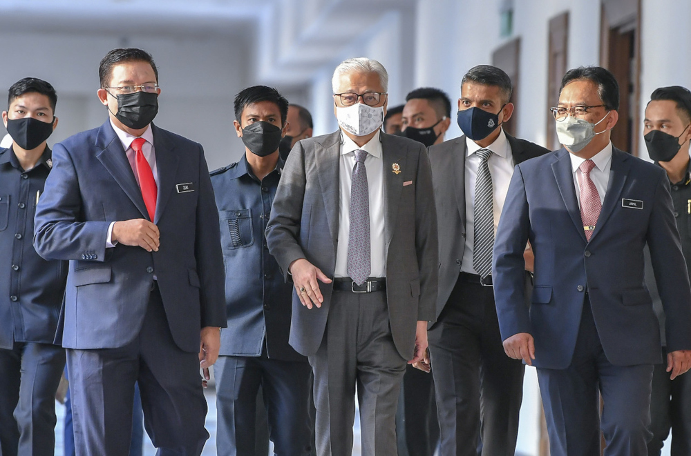 Prime Minister Datuk Seri Ismail Sabri Yaakob with Chief Secretary to the Government Tan Sri Mohd Zuki Ali (left) at the Prime Minister’s Department in Putrajaya, January 25, 2022. — Bernama pic
