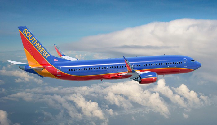 A Southwest 737 in flight over cloud cover.