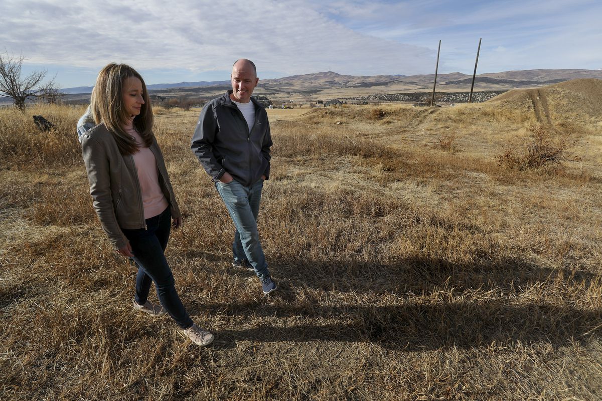 Future Utah first lady Abby Cox and her husband, Gov.-elect Spencer Cox, walk on their family’s farmland near their home in Fairview, Sanpete County, on Wednesday, Dec. 9, 2020.