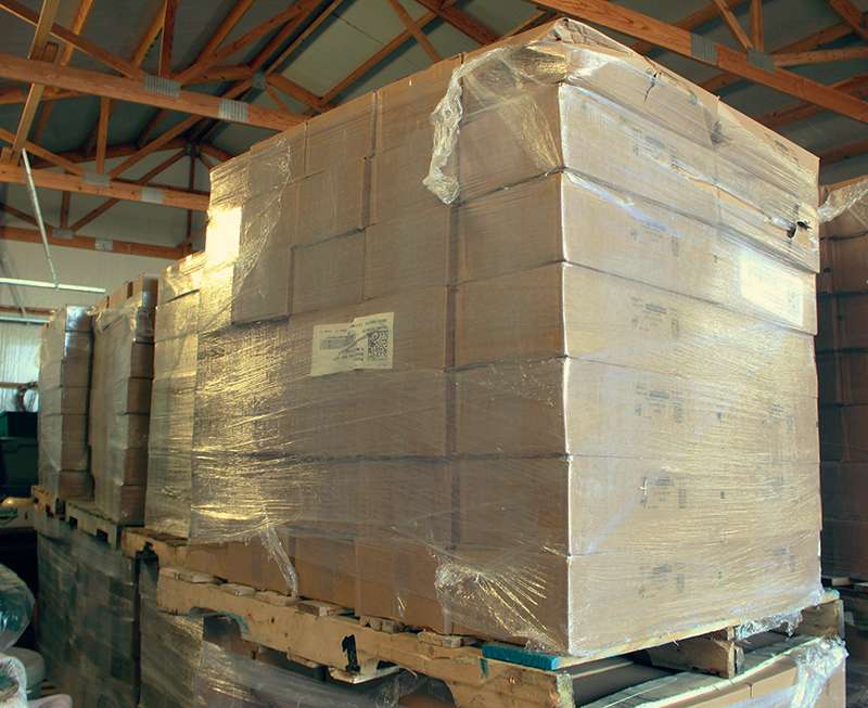 Cases of Zingers stacked up in a warehouse in Stockton. Photo by Cristina Janney / Hays Post<br>