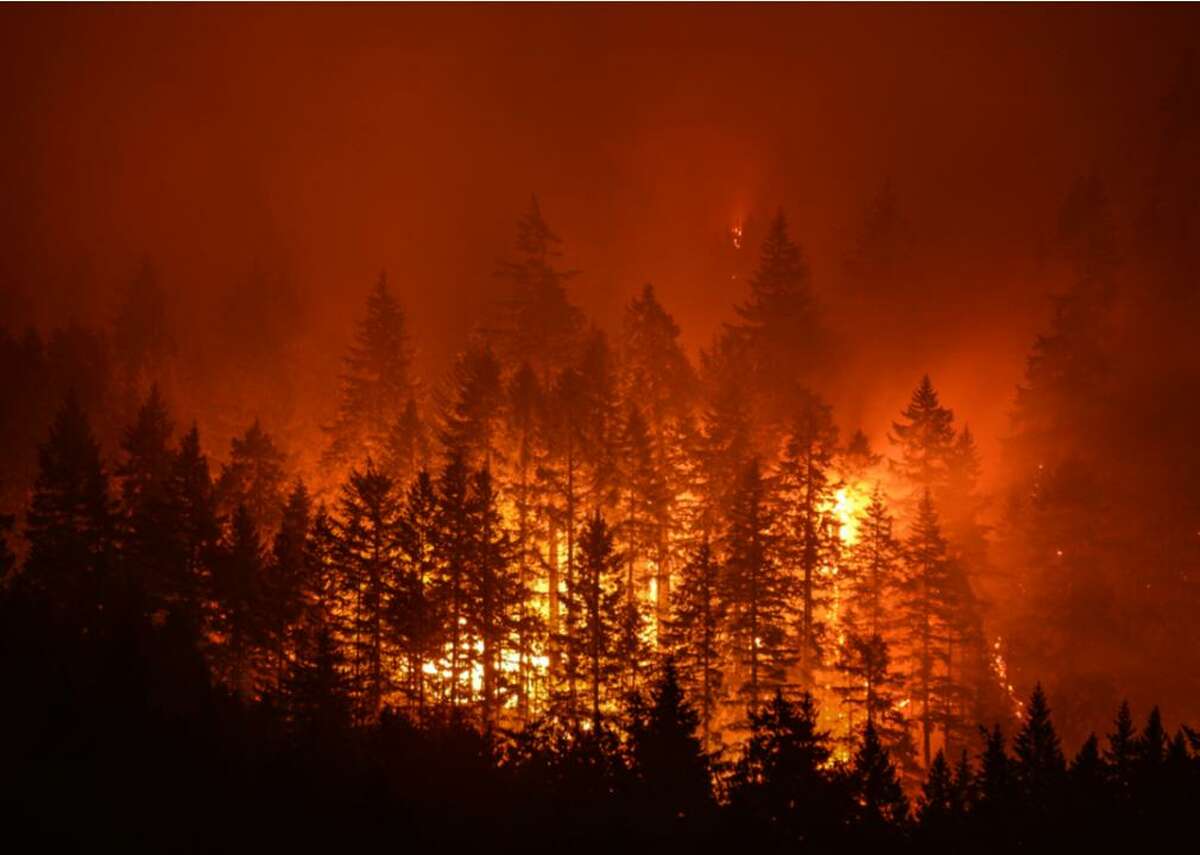 Wildfire - Economic damages between 2010–20: 0.0233% of GDP When constructing buildings and homes to avoid wildfires, choosing the right location is crucial. Ideally, construction wouldn’t take place in any danger zones, but that’s not always possible. It’s important to consider the climate, wind patterns, vegetation, and escape routes when choosing where to build. Consider the structure itself—for example, patios are more resilient than decks. Typically, patios are made from non-flammable materials whereas decks are made from wood and can trap vegetation beneath them, which act as fuel. For similar reasons, slab-on-grade and full basement foundations provide more protection as opposed to pier foundations or crawl spaces, where vegetation and other flammable debris can accumulate. Building a house from concrete and other masonry materials provide the greatest protection from fire, and insulated windows contribute even more to architectural resilience.