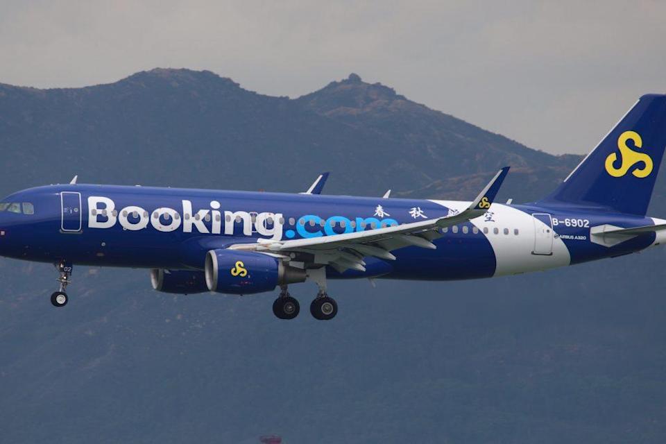 Pictured is a Spring Airlines A320 bedecked as Booking.com as seen on July 7, 2018. Booking sees flights as key to its connected trip strategy. Kwok Ho Eddie Wong / Flickr.com