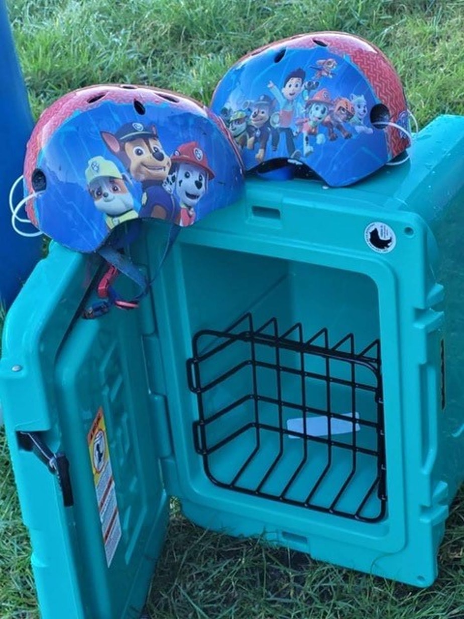 caption: This cooler and children's bicycle helmets washed up on Clayoquot Sound on the west coast of Canada's Vancouver Island.
