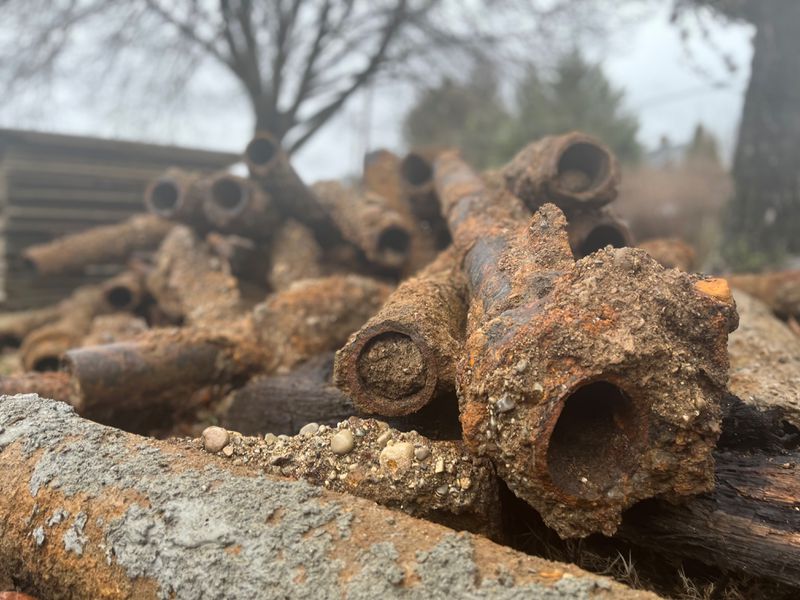 Old and likely abandoned utility pipes that were removed in the South Park area, as crews prepared to install new mains on multiple streets. CORNELIUS FROLIK / STAFF