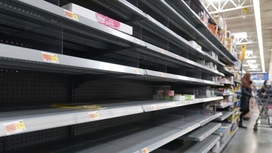 A section of empty shelves is seen at a Walmart store in Teterboro, N.J., Wednesday, Jan. 12, 2022.