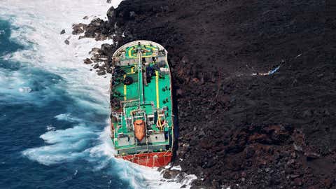 This aerial image taken Feb. 11, 2022, shows the Mauritian oil tanker Tresta Star, stranded off the coast of Reunion Island after the passage of Tropical Cyclone Batsirai. (Photo by RICHARD BOUHET/AFP via Getty Images)