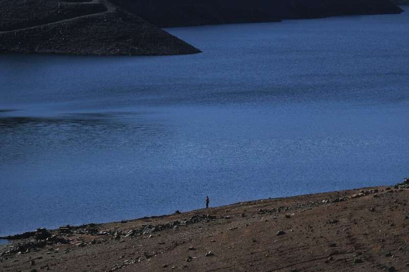 Vilar stands on the banks of the river, surrounded by cracked yellow earth, another sign of the ongoing dry spell during what is normally a rainy winter season, with the drought also hitting neighbouring Spain. Vilar stands on the banks of the river, surrounded by cracked yellow earth, another sign of the ongoing dry spell during what is