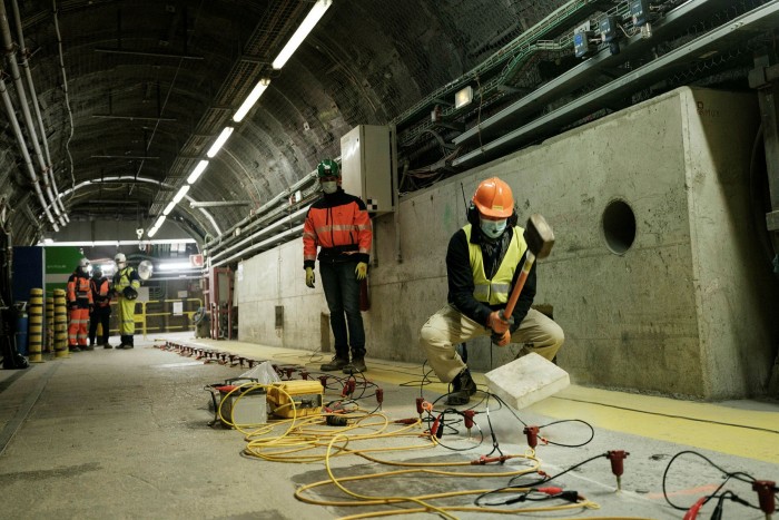 A worker hammers the floor every metre to measure vibrations and seismic shocks 500 metres below ground level at the Cigeo site near Bure, France