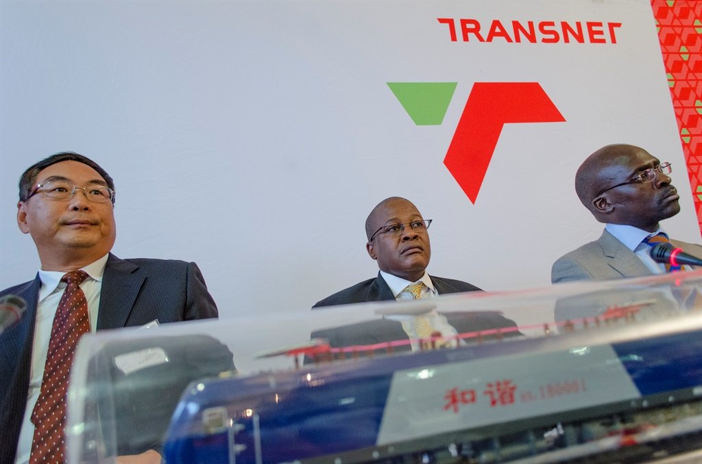 A China South Rail official, former Transnet CEO Brian Molefe and erstwhile public enterprises minister Malusi Gigaba. 