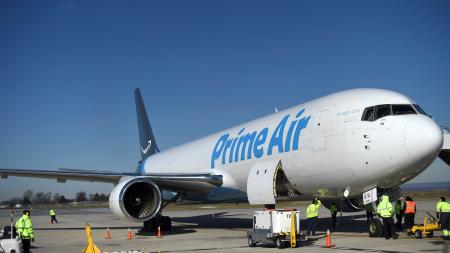 A wide body aircraft emblazoned with Amazon&#039;s Prime logo is unloaded at Lehigh Valley International Airport in Allentown, Pennsylvania.