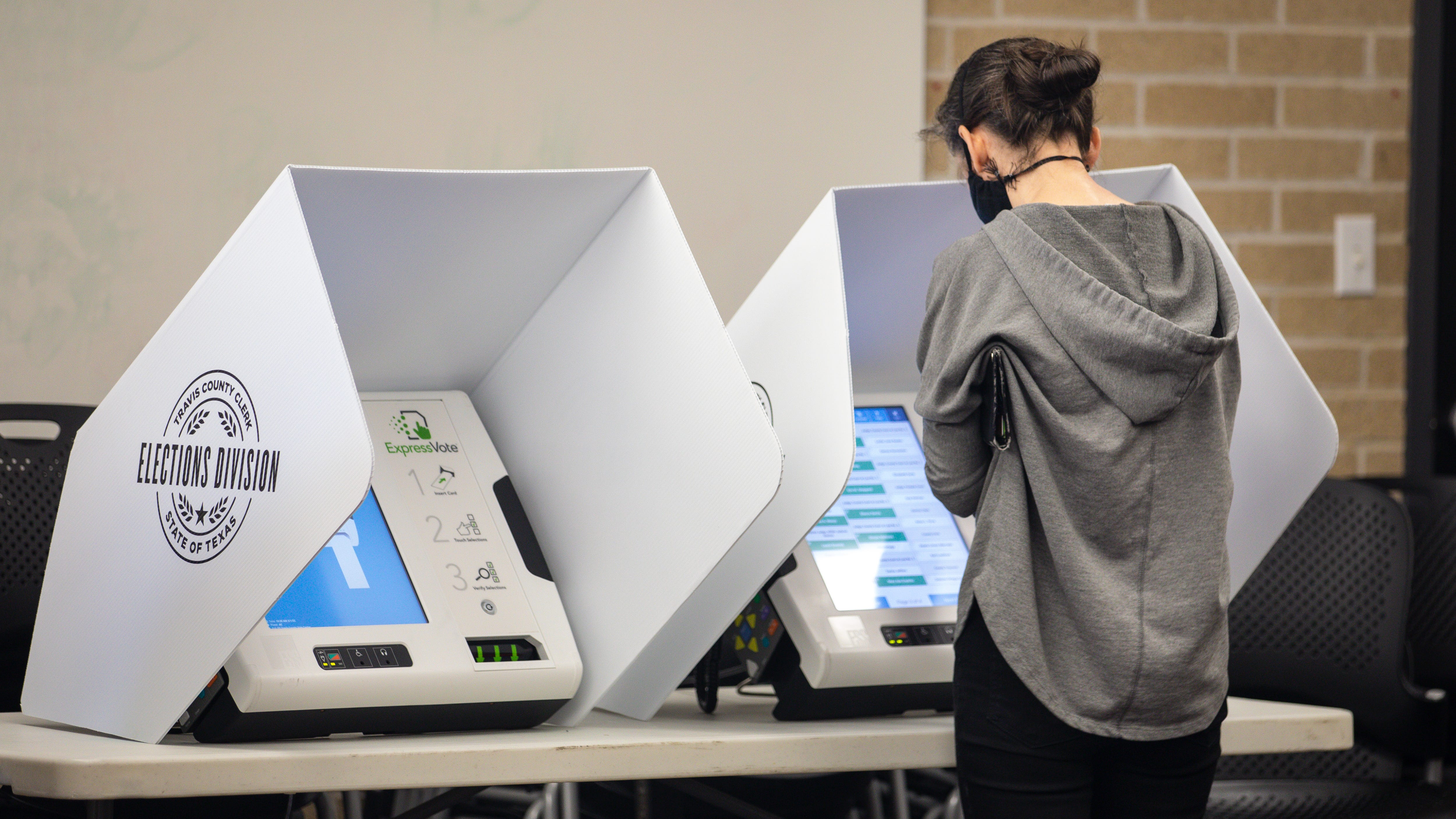 AUSTIN, TX: People vote at the Carver Branch Library on March 1, 2022 in Austin, Texas. Texans voted in the states first primary of the 2022 midterm election season. The state was among those where election officials have warned of paper shortages. (Photo by Montinique Monroe/Getty Images)