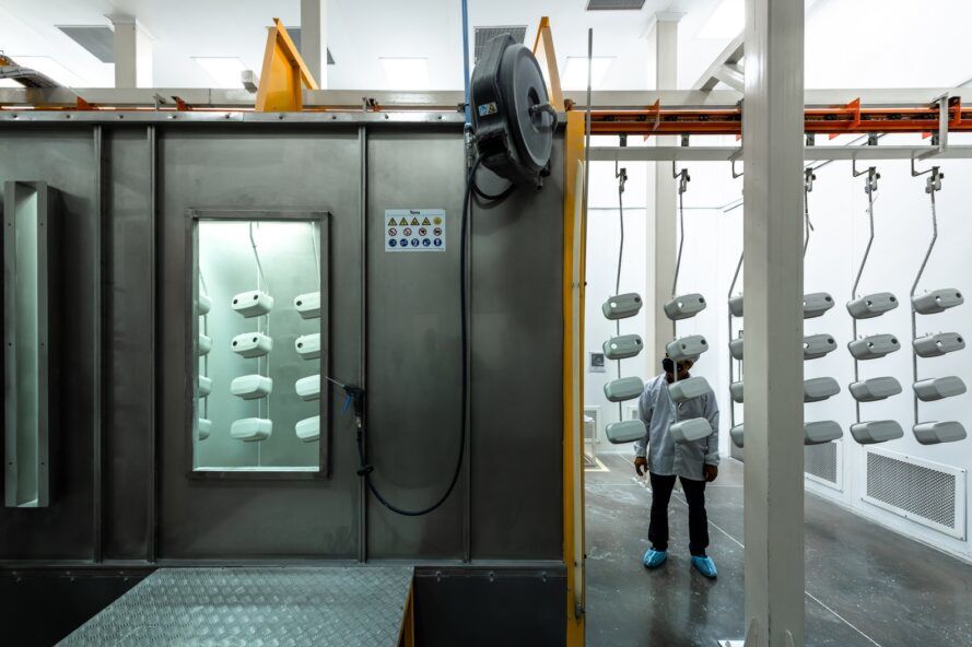 A metal device with a person standing next to it