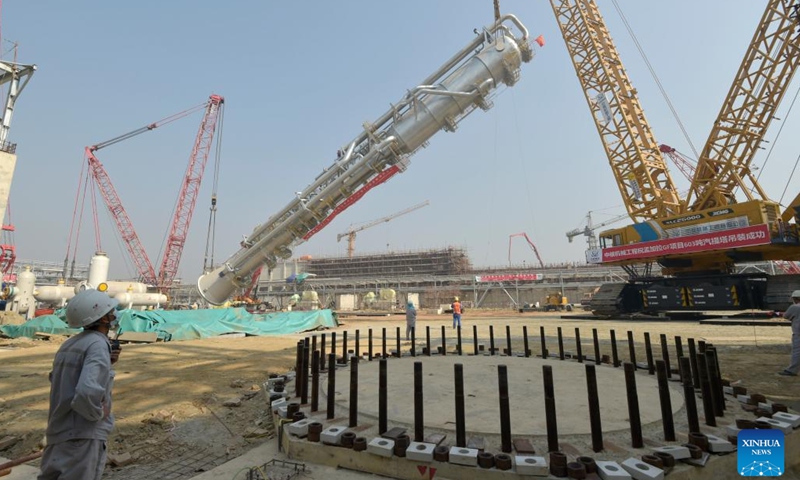 A carbon dioxide stripper tower is installed at a fertilizer plant under construction in Narsingdi, Bangladesh, on March 8, 2022. The carbon dioxide stripping tower, the first super-heavy equipment of Bangladesh's Ghorashal-Polash Urea fertilizer project (GPUFP), the country's largest and first ever green fertilizer factory, was installed successfully on Tuesday.(Photo: Xinhua)