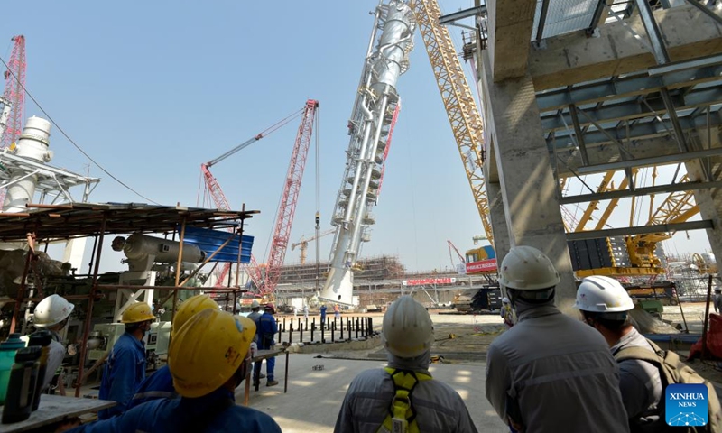 A carbon dioxide stripper tower is installed at a fertilizer plant under construction in Narsingdi, Bangladesh, on March 8, 2022. The carbon dioxide stripping tower, the first super-heavy equipment of Bangladesh's Ghorashal-Polash Urea fertilizer project (GPUFP), the country's largest and first ever green fertilizer factory, was installed successfully on Tuesday.(Photo: Xinhua)