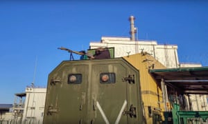 Am image from a handout video by the Russian Defence Ministry purportedly showing a Russian servicemen guard in front of the Chernobyl nuclear power plant in Pripyat, Ukraine on Monday.
