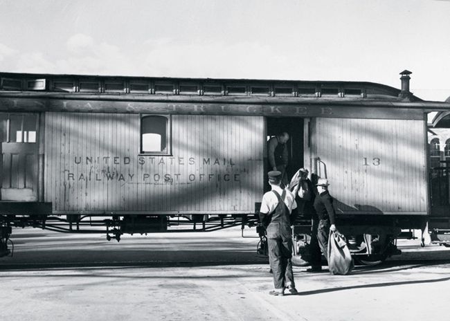 In Carson City, Nevada, men load mail into RPO #13 of the Virginia & Truckee Railway, which carried mail between Reno and Minden, Nevada, until 1950. Through the early 20th century RPOs were a dangerous place to be on a train – they were of relatively lightweight construction and were located near the front of the train, behind the much-heavier locomotive. Casualties in the railway mail service were high: between 1885 and 1908, 180 clerks were killed and 1,598 were seriously injured. This photograph was taken by Photographer Arthur Rothstein during the five years he spent documenting rural America for the U.S. Farm Security Administration.
(Photo: Library of Congress)