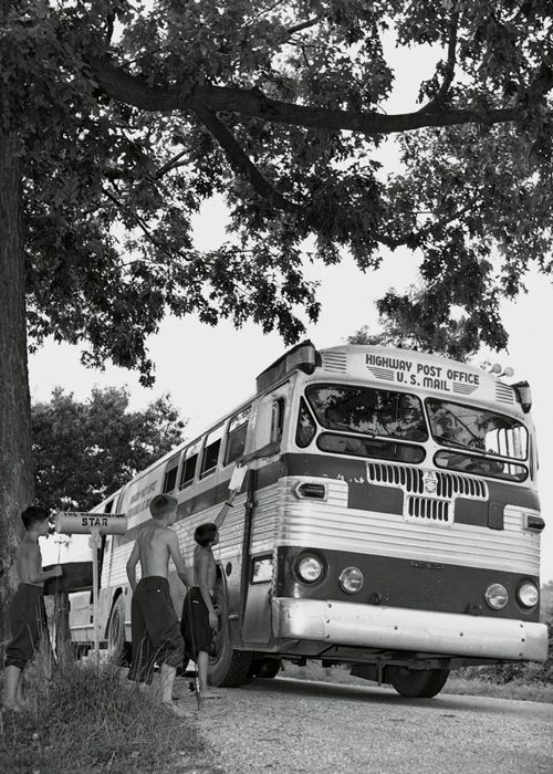 In 1941, Highway Post Offices (HPOs) made their first appearance when a route was established between Washington, D.C., and Harrisonburg, Virginia, serving more than 20 intermediate post offices. HPOs were similar in function to RPOs and were created in part due to the decline of mail-carrying trains. Like railway mail clerks aboard trains, clerks on board HPOs sorted mail en route for transfer to post offices and connecting routes. The number of HPOs peaked at 172 in 1959. The spread of mechanized mail sorting facilities in the 1960s and 1970s gradually rendered hand-sorting of mail by traveling clerks obsolete. The last HPO rolled between Cincinnati and Cleveland, Ohio, on June 30, 1974. (Photo: USPS Collection)