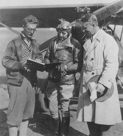 Official timer Joseph A. Nikrent consults with Evelyn Trout, while Will Rogers looks on, at Mines Field, Los Angeles, California, February 11, 1929. (Photo: Unattributed/thisdayinaviation.com)