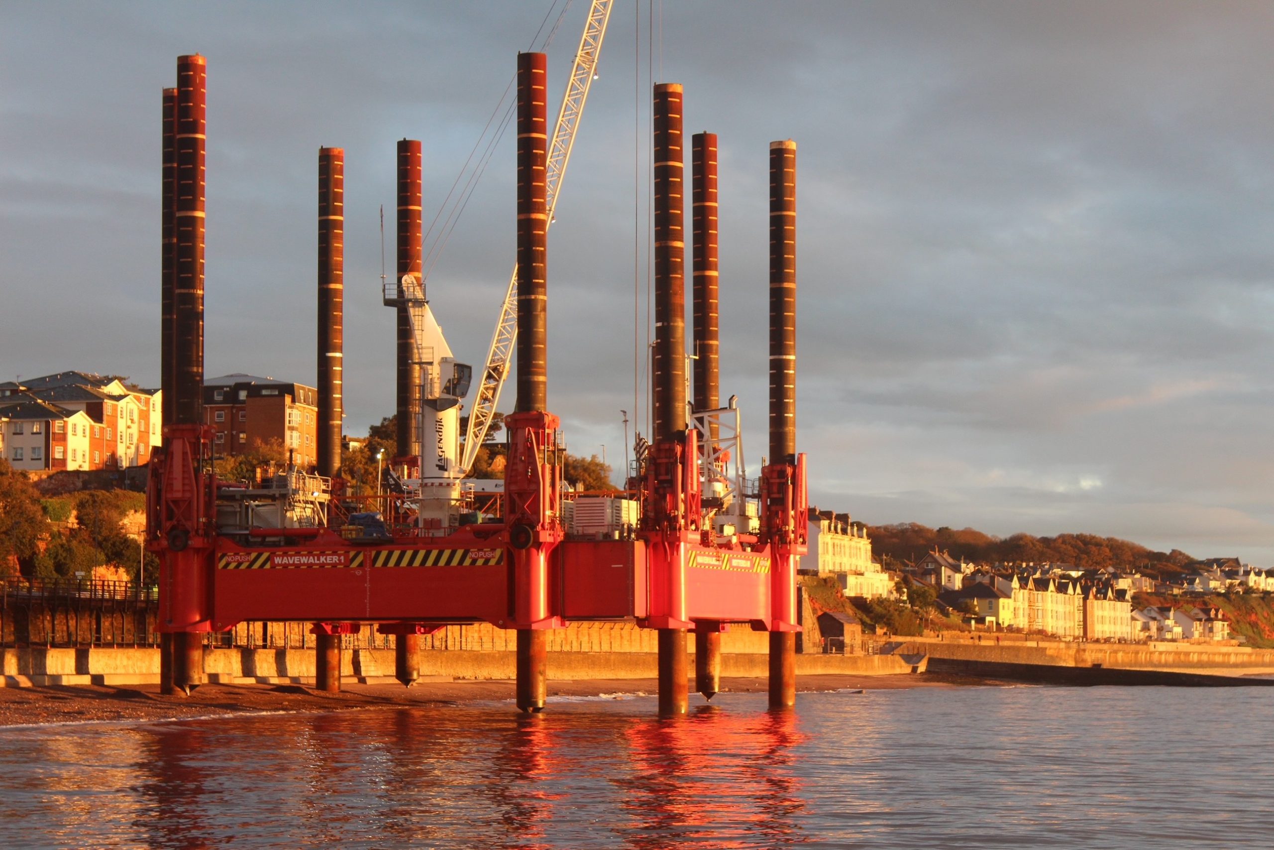 Wavewalker on coast of Dawlish in sunset 